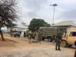 Somali National Army troops and armoured vehicles on a street in Baidoa during Monday's fighting with forces loyal to former president Laftagareen