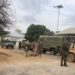 Somali National Army troops and armoured vehicles on a street in Baidoa during Monday's fighting with forces loyal to former president Laftagareen