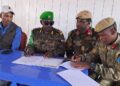Ethiopian and Somali officers sign the transfer documents at the Buurhakaba base handover in Bay region