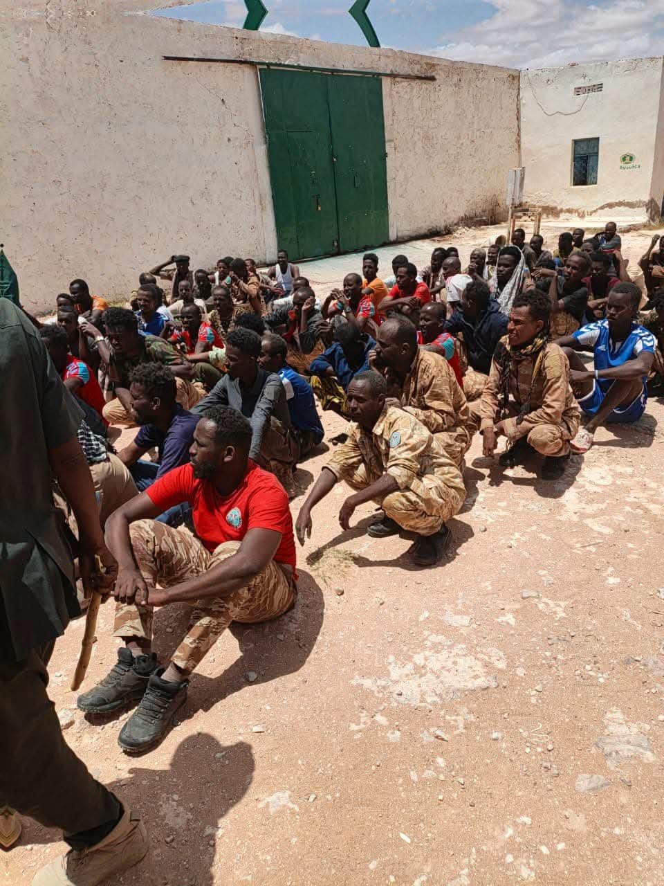 Captured PSF fighters seated on the ground after Puntland forces overran the Galkayo camp