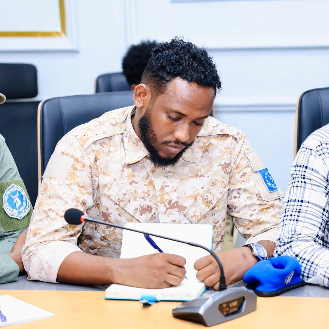 Cabdulqaadir Cismaan Shiine, Somali Police Force officer and deputy commander of the JIT special unit, writing a statement after capture at the Galkayo camp