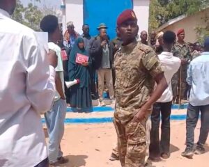 Residents and local officials protesting in Doolow in Gedo region after the strike on General Mahad Abdirahman, one demonstrator holding a placard bearing the Turkish flag