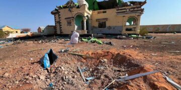 The wrecked compound in Doolow, its roof torn open and a crater in the yard, after the air strike of 4 September 2026